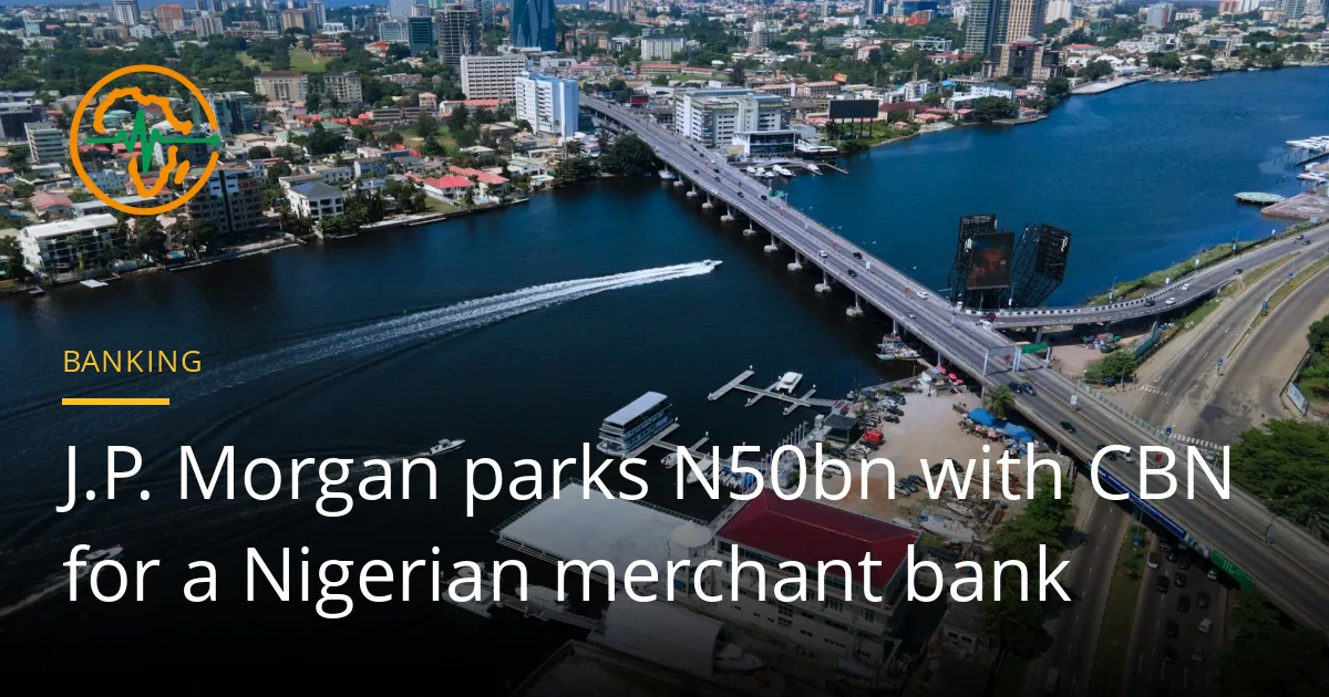 Aerial view of Victoria Island, Lagos, with boats crossing the lagoon beside the Falomo bridge and office towers behind