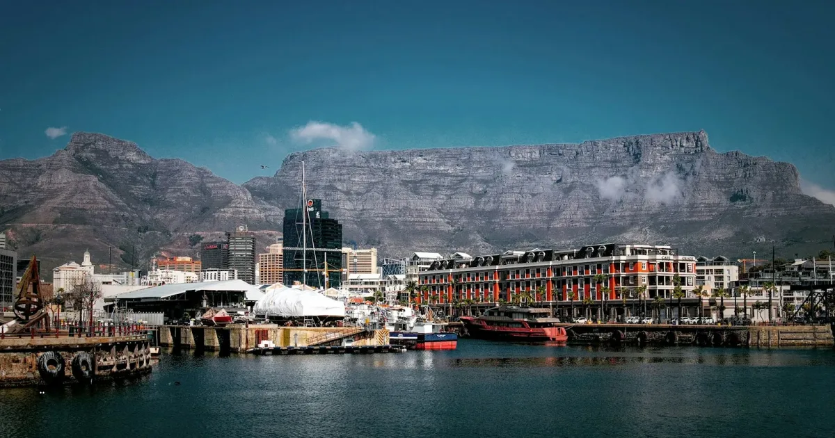 Cape Town's V&A Waterfront harbour and city buildings beneath Table Mountain on a clear day